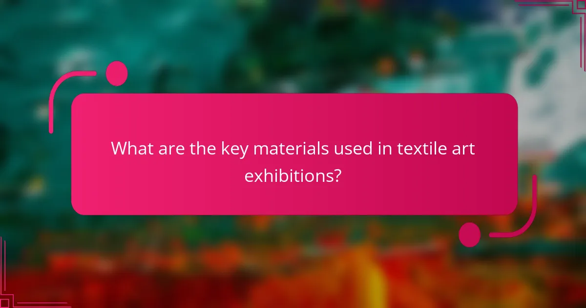What are the key materials used in textile art exhibitions?